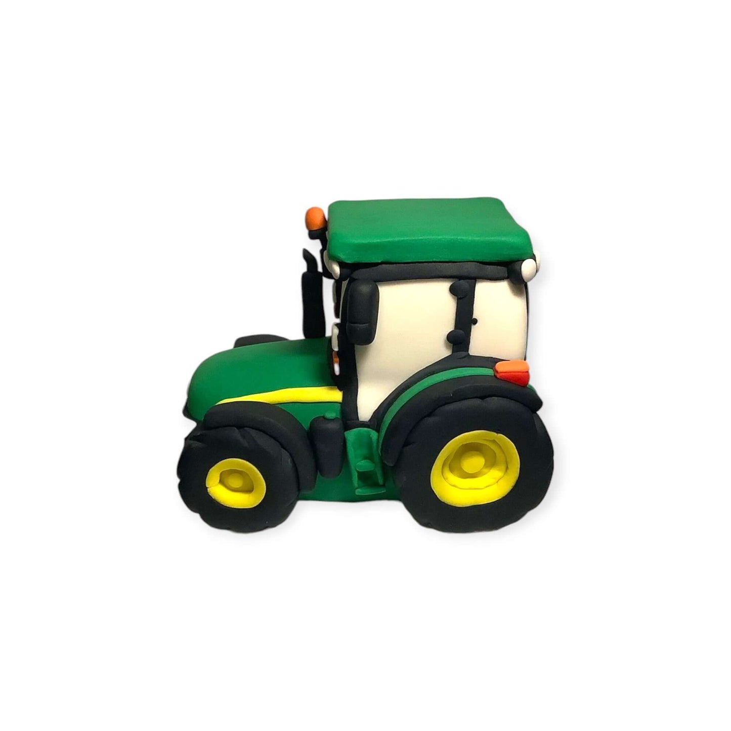 nearside view of a handmade fondant tractor in great detail