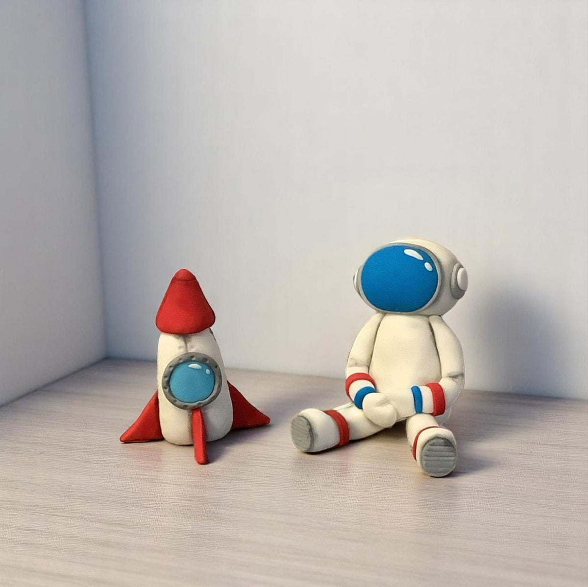 handmade sugar paste astronaut and rocket  