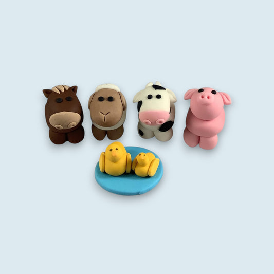 Assortment of edible farm animal cake toppers