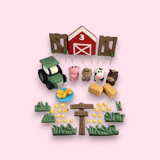 edible full farm cake topper set with tractor, barn, fences, a selection of farm animals, haybales, grass, flowers and personalised sign